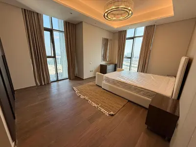 a large bedroom with a bed and large windows at Luxury 2BR - Nobles Tower - Business Bay in Dubai