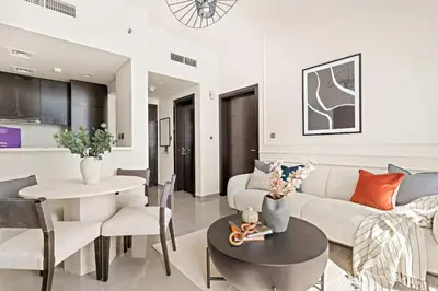 a living room with a couch and a table at Silkhaus Modern 2BR in Merano Tower in Business Bay in Dubai