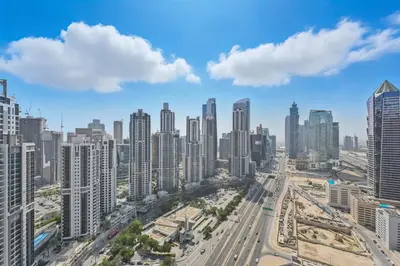 an aerial view of a city with tall buildings at CH Burj Khalifa View Pool 1BR Paramount Escape in Dubai