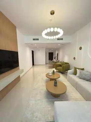 a living room with a couch and two tables at Duja Tower 4405 in Dubai
