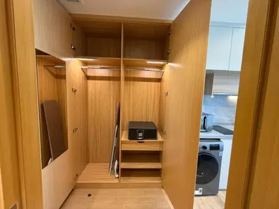 a walk in closet with a microwave and a stove at Luxery Hotel Apartment l Novotel Residence l JVT in Dubai