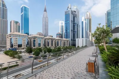 a city skyline with tall buildings and a bridge at FIRST CLASS 2BR Elegant Duplex Haven in Dubai