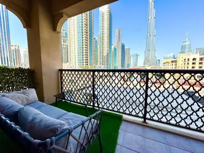 a balcony with a couch and a view of a city at Burj Khalifa View 2 Bed Luxury Apartment in Dubai