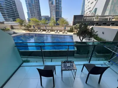 a view of a swimming pool on top of a building at Studio in Business Bay with Huge Balcony & Pool View near to Metro in Dubai