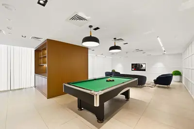 a billiard room with a pool table in it at New, Bright & Cozy 1BD at Paragon by IGO, Dubai in Dubai