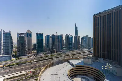 a view of a city with a highway and buildings at The Lavish Suite in Dubai