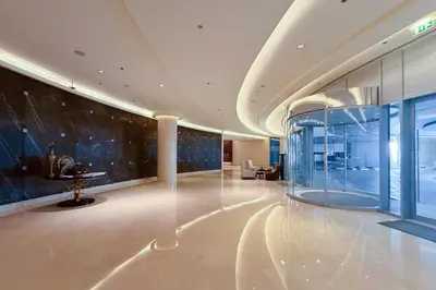 a large lobby with a glass wall at The Lavish Suite in Dubai