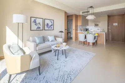 a living room with a couch and a table at Frank Porter - Address Opera Tower in Dubai