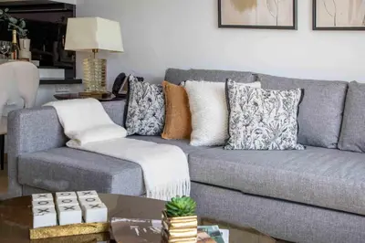 a living room with a couch and a table at Frank Porter - Marina Mall Hotel in Dubai