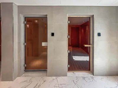 two glass doors on a wall with a hallway at Frank Porter - Azizi Riviera Azure, Meydan in Dubai