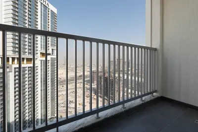a balcony with a view of a city at Premium 1BR Stay with Balcony & City View, Nad Al Sheba in Dubai