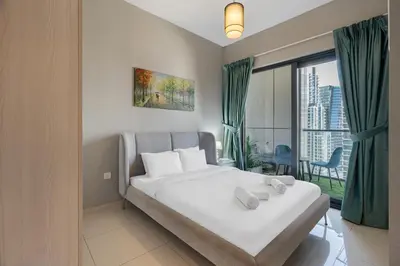 a bedroom with a bed and a large window at Zada Tower, Business Bay - 1 Bedroom - Allsopp & Allsopp in Dubai