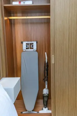 a bedroom with a bic phone next to a bed at NEW! Studio in Azizi Riviera 59 in Dubai