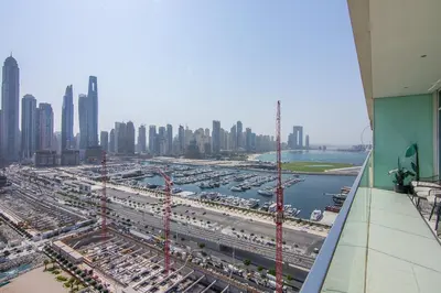 an aerial view of a harbor with a city at Luxury 3BR plus Maids Room in Emaar Beachfront in Dubai