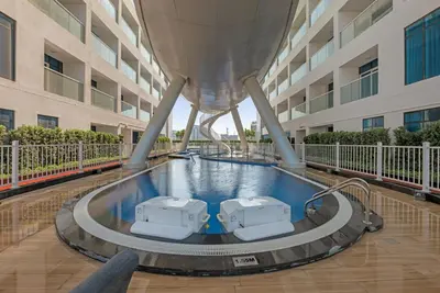 a swimming pool in the middle of a building at Opal by Danube | Designer 1BR | Private Jacuzz in Dubai
