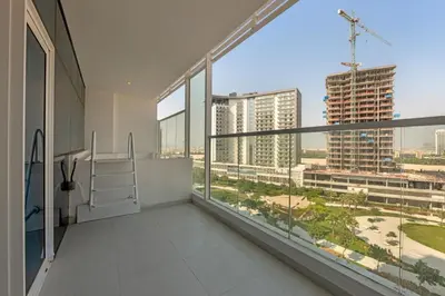 an apartment balcony with views of a city at Opal by Danube | Designer 1BR | Private Jacuzz in Dubai