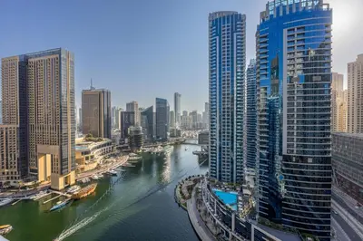 a view of a river in a city with tall buildings at ShoresInn - Luxe Waterfront in Heart of Marina in Dubai