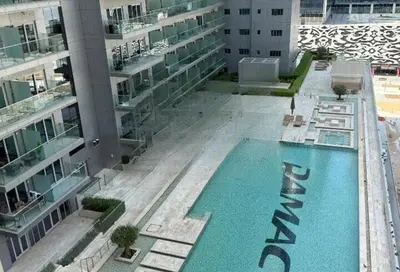 an overhead view of a swimming pool in a building at Premium Studio Majestine by DAMAC, Business Hub in Dubai
