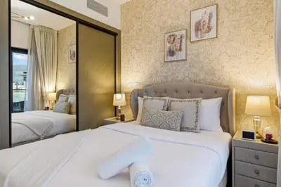 a bedroom with two beds and a large mirror at Creek Harbour Views 1BR, Just Minutes from Ras Al Khor Wildlife Sanctuary and Short Stroll to Zabeel Stadium, Binghatti Creek, Al Jaddaf by Deluxe Holiday Homes in Dubai