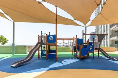 a playground under a tent with a slide at Luxury 3 bed with Burj Khalifa and Dubai Skyline View in Dubai