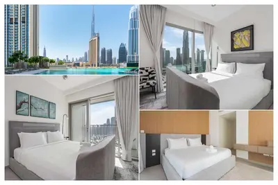 a hotel room with two beds and a view of a city at Luxury 3 bed with Burj Khalifa and Dubai Skyline View in Dubai