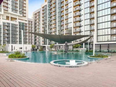 a large sculpture in front of some tall buildings at FIRST CLASS 3BR Stylish Luxury Escape in Dubai