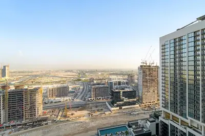 an aerial view of a city with tall buildings at FIRST CLASS 3BR Stylish Luxury Escape in Dubai