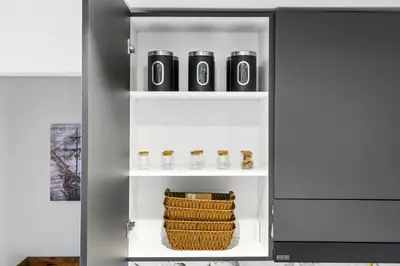 a small refrigerator with a basket on the shelf at New 1BR with Rooftop Pool and Amazing View in Dubai