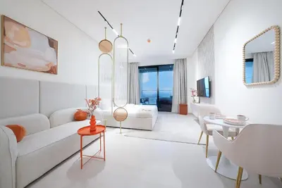 a living room with a white couch and a table at Premium Stay at High-Floor Trillionaire Studio in Dubai