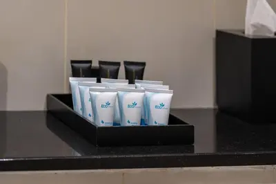 a group of white cups in a black box at DAMAC Cour Jardin - Pool & Gym - Free Parking in Dubai
