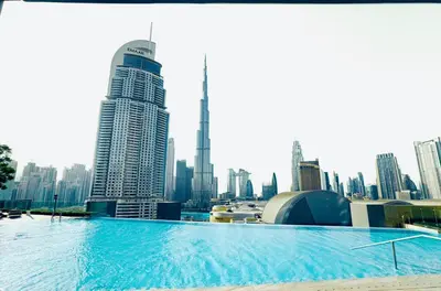 a large swimming pool on the roof of a building at Luxury 2-Bedroom Apartment with Stunning City Views By Norbu Holiday Homes in Dubai