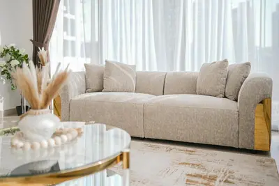a living room with a couch and a glass table at Luxury 2-Bedroom Apartment with Stunning City Views By Norbu Holiday Homes in Dubai