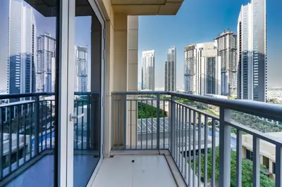 a balcony with a view of the city at Close to Ras Al Khor Wildlife Sanctuary, Just Minutes from Dubai Mall and Burj Khalifa, and Surrounded by Exceptional Amenities - Harbour Views Tower 1, Dubai Creek Harbour by Deluxe Holiday Homes in Dubai