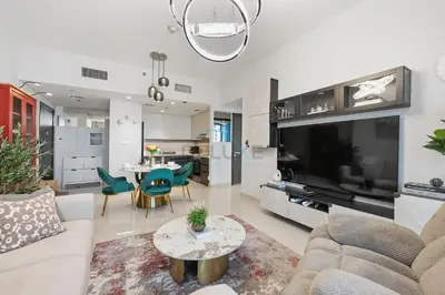 a living room with a couch and a table at Close to Ras Al Khor Wildlife Sanctuary, Just Minutes from Dubai Mall and Burj Khalifa, and Surrounded by Exceptional Amenities - Harbour Views Tower 1, Dubai Creek Harbour by Deluxe Holiday Homes in Dubai