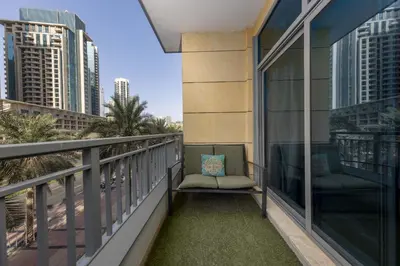 a balcony with two chairs and a view of the city at VayK - Great 1BR in Downtown near Burj Khalifa in Dubai