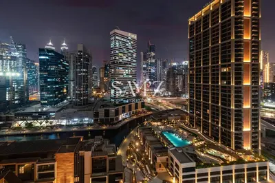 a view of a city at night with buildings at Bright 1BR - Unit 1806 - City Views & Fast Wi-Fi in Dubai