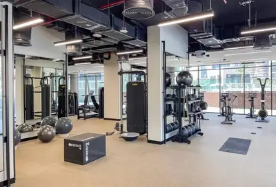 a gym with lots of equipment in a room at Bright 1BR - Unit 1806 - City Views & Fast Wi-Fi in Dubai