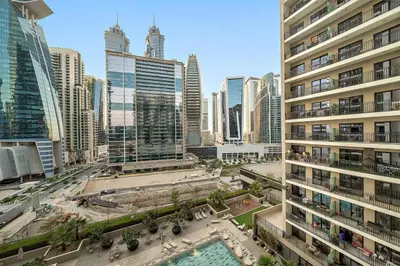 an aerial view of a city with tall buildings at FIRST CLASS 1BR Pool View & Prime Location in Dubai