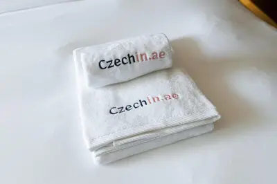a white towel with the words czechline on it at Five Palm Luxury Stay 2BR with Pool & Beach Access in Dubai