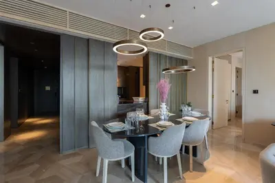 a dining room with a table and chairs at Five Palm Luxury Stay 2BR with Pool & Beach Access in Dubai