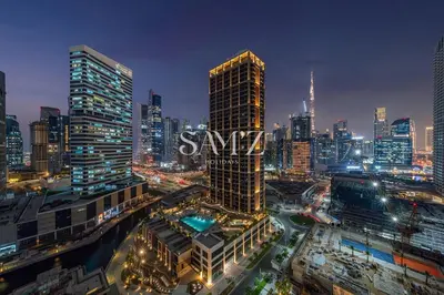 a city skyline at night with the word amwx at Modern Studio - Unit 1705 - Near Downtown in Dubai
