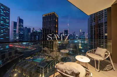 a balcony with a view of a city skyline at Modern Studio - Unit 1705 - Near Downtown in Dubai
