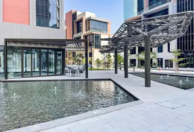 a fountain in a courtyard in a city with buildings at Modern Studio - Unit 1705 - Near Downtown in Dubai