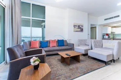 a living room with two couches and a table at Huge Balcony Overlooking Creek Harbour with Glimpses of Burj Khalifa, Just Minutes from Zabeel Stadium, Azizi Aliyah Residence, Al Jaddaf by Deluxe Holiday Homes in Dubai