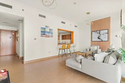 a living room with a couch and a table at FIRST CLASS 2BR Breathtaking Marina Views in Dubai