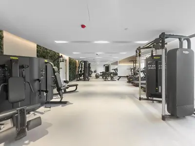 a fitness room with a gym with tread machines at VayK - Modern Studio with Great Amenities in Dubai