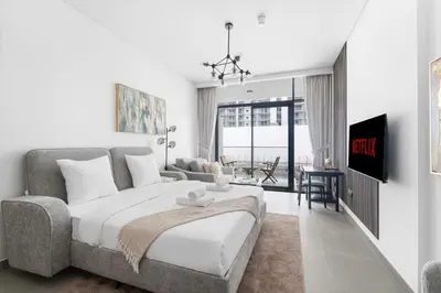 a bedroom with a bed and a couch at VayK - Modern Studio with Great Amenities in Dubai
