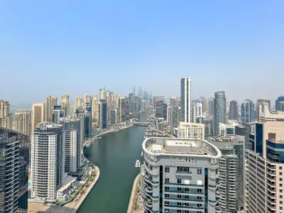 an aerial view of a large city with a river at VayK - Ultra-Luxury 3BR Marina Retreat with Stunning View in Dubai