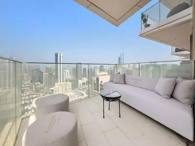 a living room with a couch and a view of the city at VayK - Ultra-Luxury 3BR Marina Retreat with Stunning View in Dubai