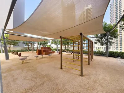 a pavilion with a canopy with benches and a playground at VayK - Stylish 1BR in Prime Downtown Location in Dubai